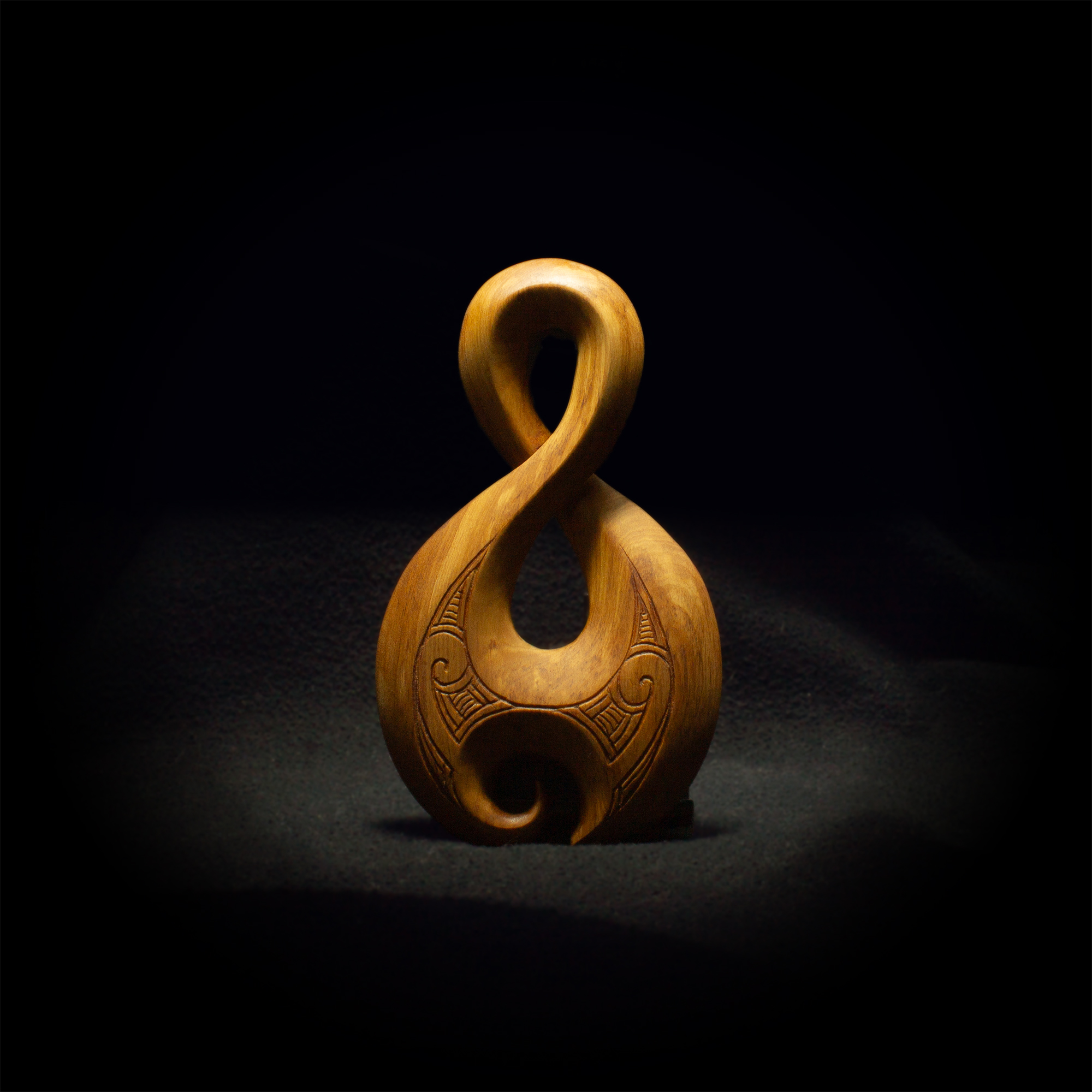 Artwork: Pikorua, a twisted loop carving.